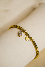 Pulseira dourada com brilhantes