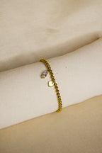 Pulseira dourada com brilhantes