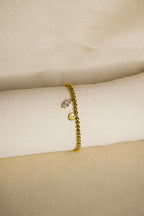 Pulseira dourada com brilhantes