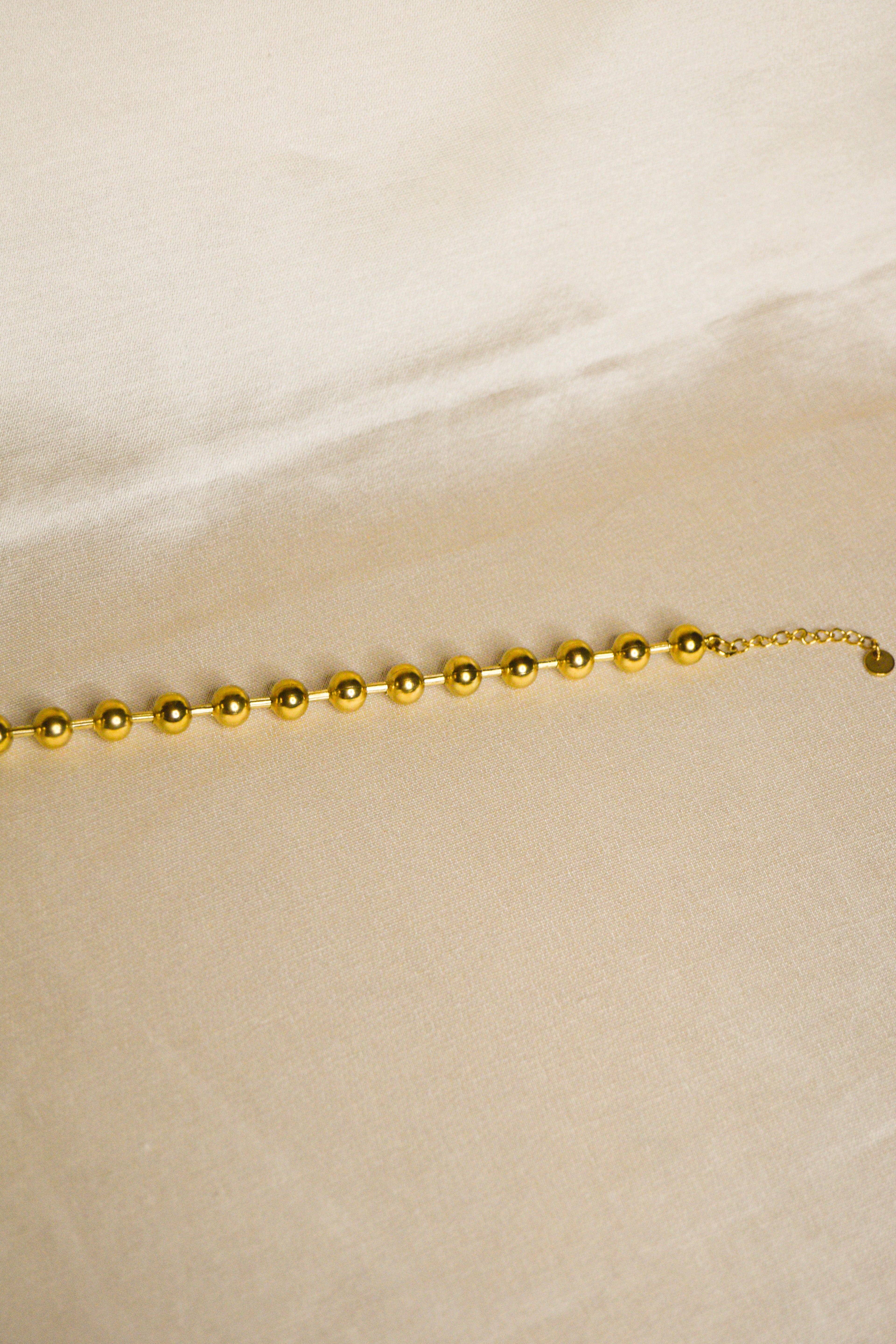 Pulseira dourada bolas grandes