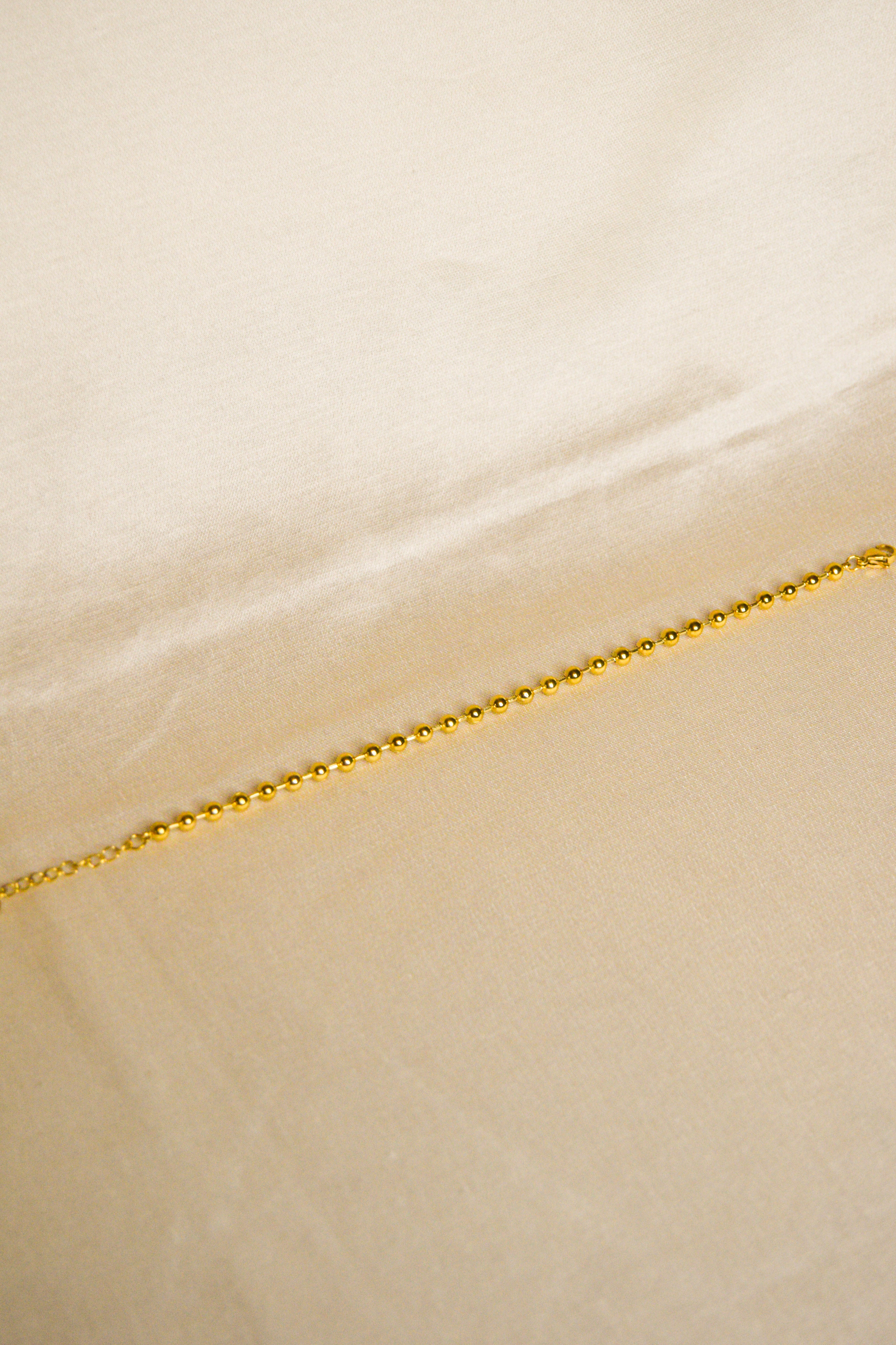 Pulseira dourada bolas pequenas