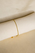 Pulseira dourada fina tranças