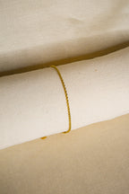 Pulseira dourada fina tranças