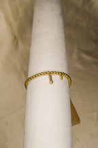 Pulseira dourada pendente punho