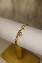 Pulseira dourada com laços