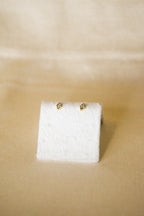 Piercing dourado losango