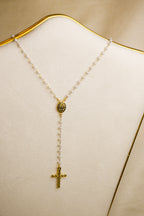 Terço dourado com cruz