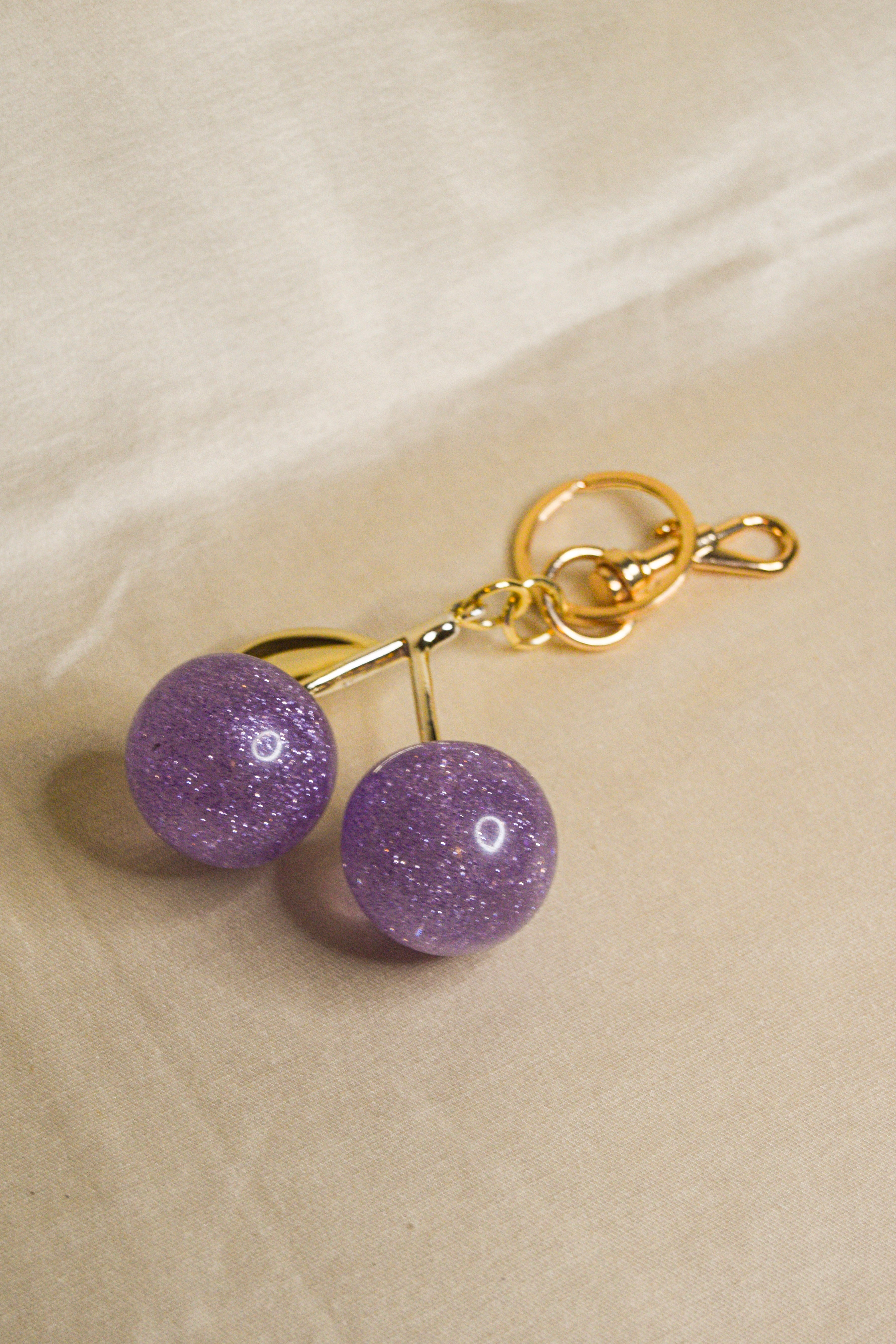 Porta-chaves cerejas roxas